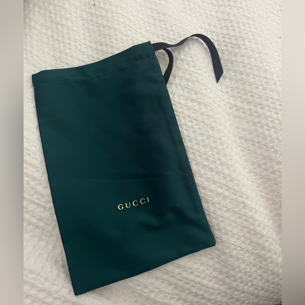 Green Gucci dust bag